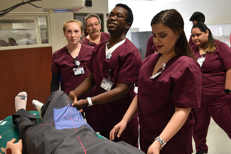 Group of students training to work in a radiography room