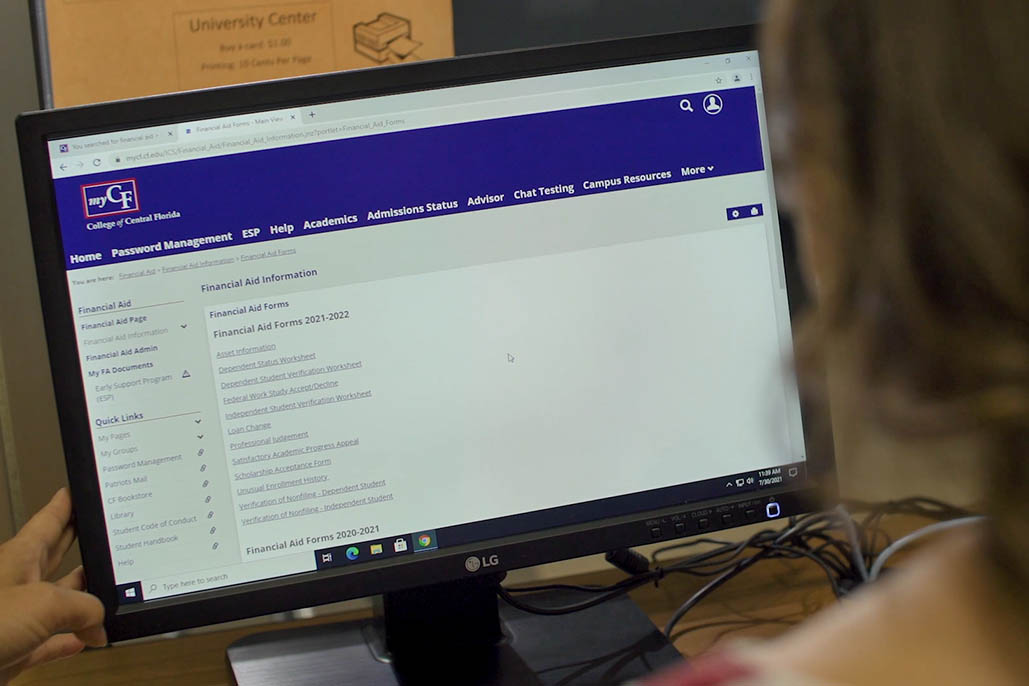 Student Checking Financial Aid on the Computer