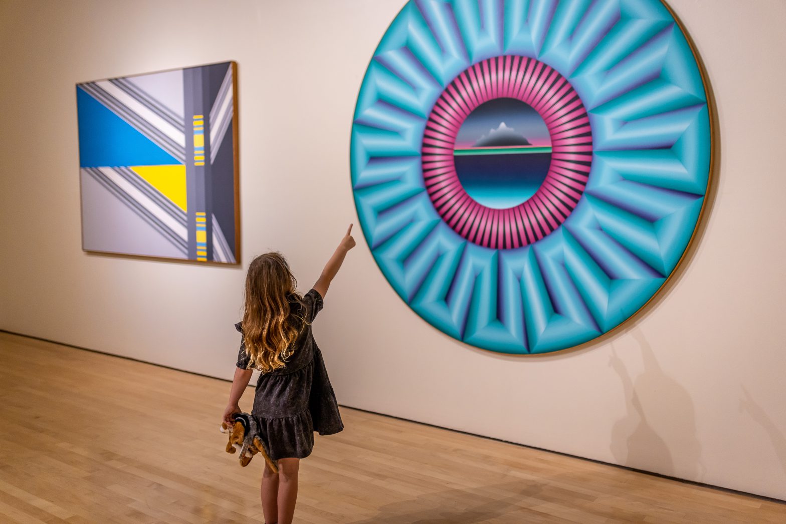 Child points at painting