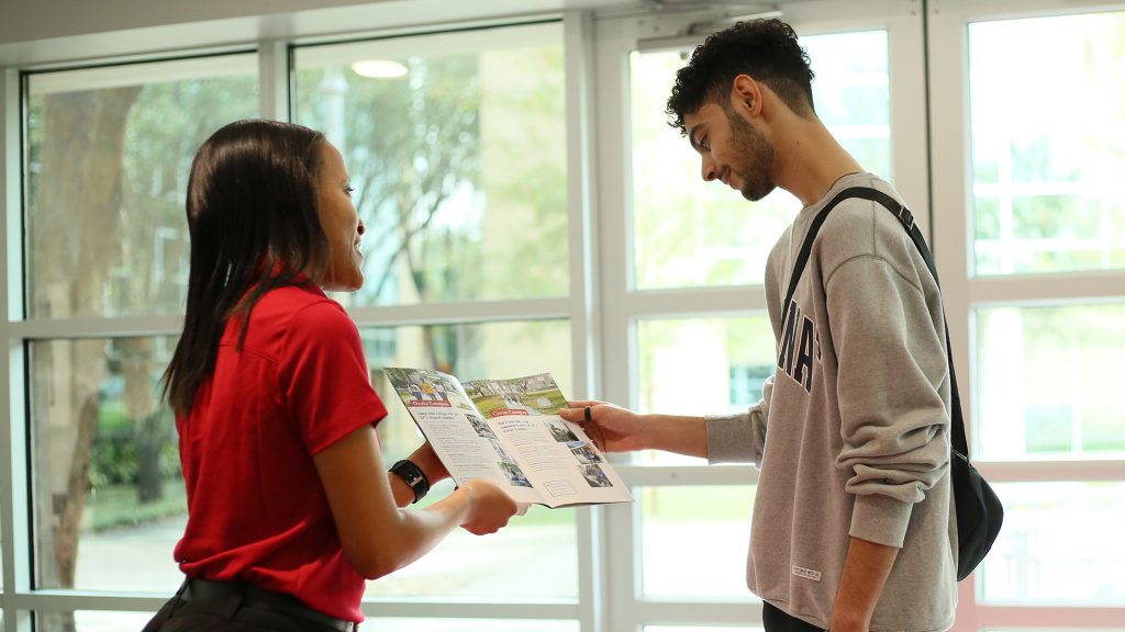 Student meeting staff at a Open House