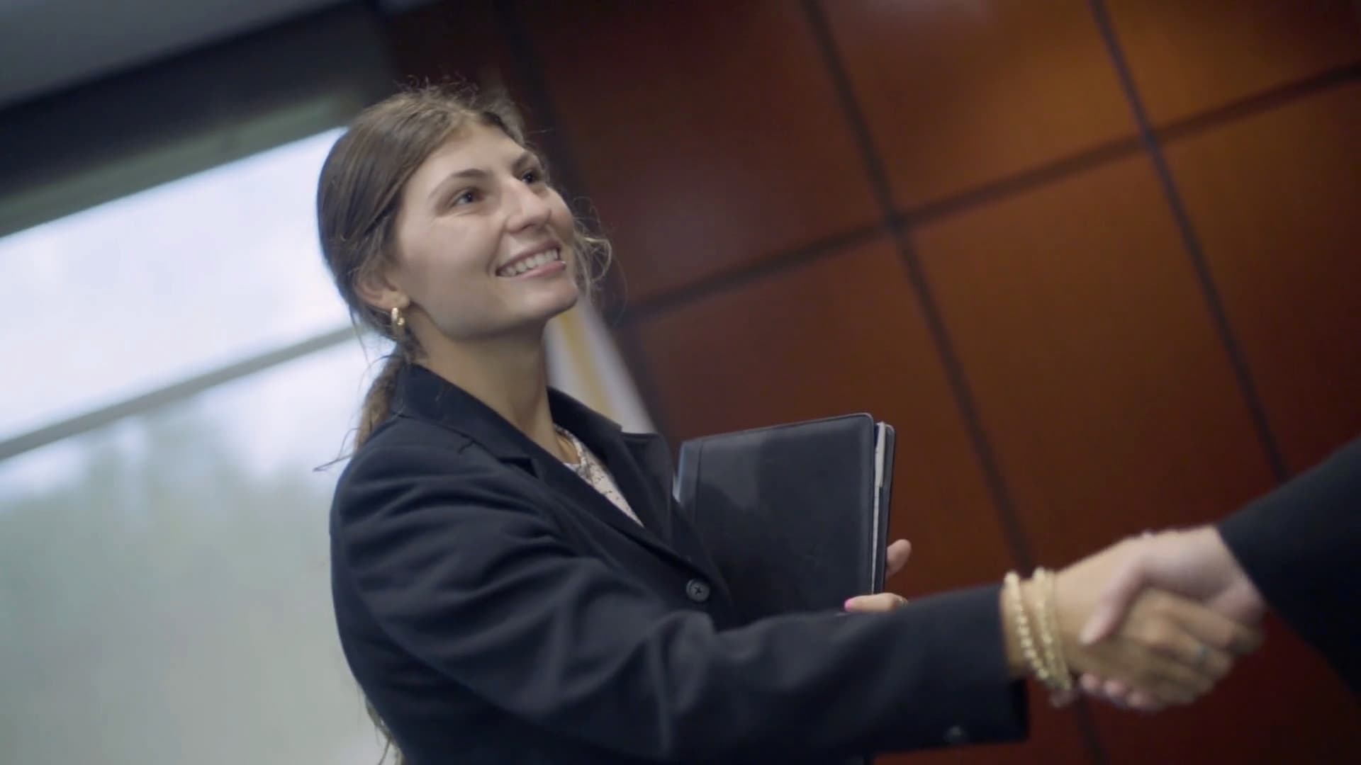 Business Interview - student shaking hands