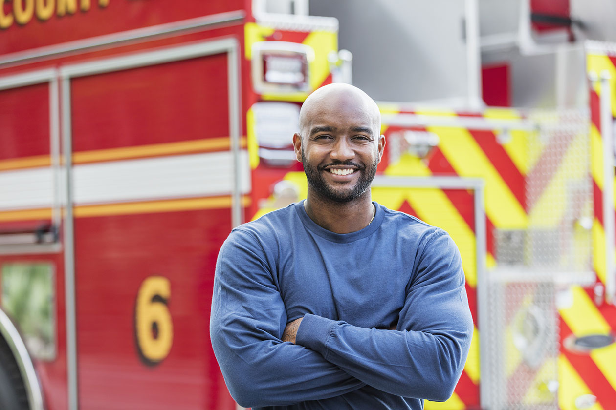 Firefighter in front of truck