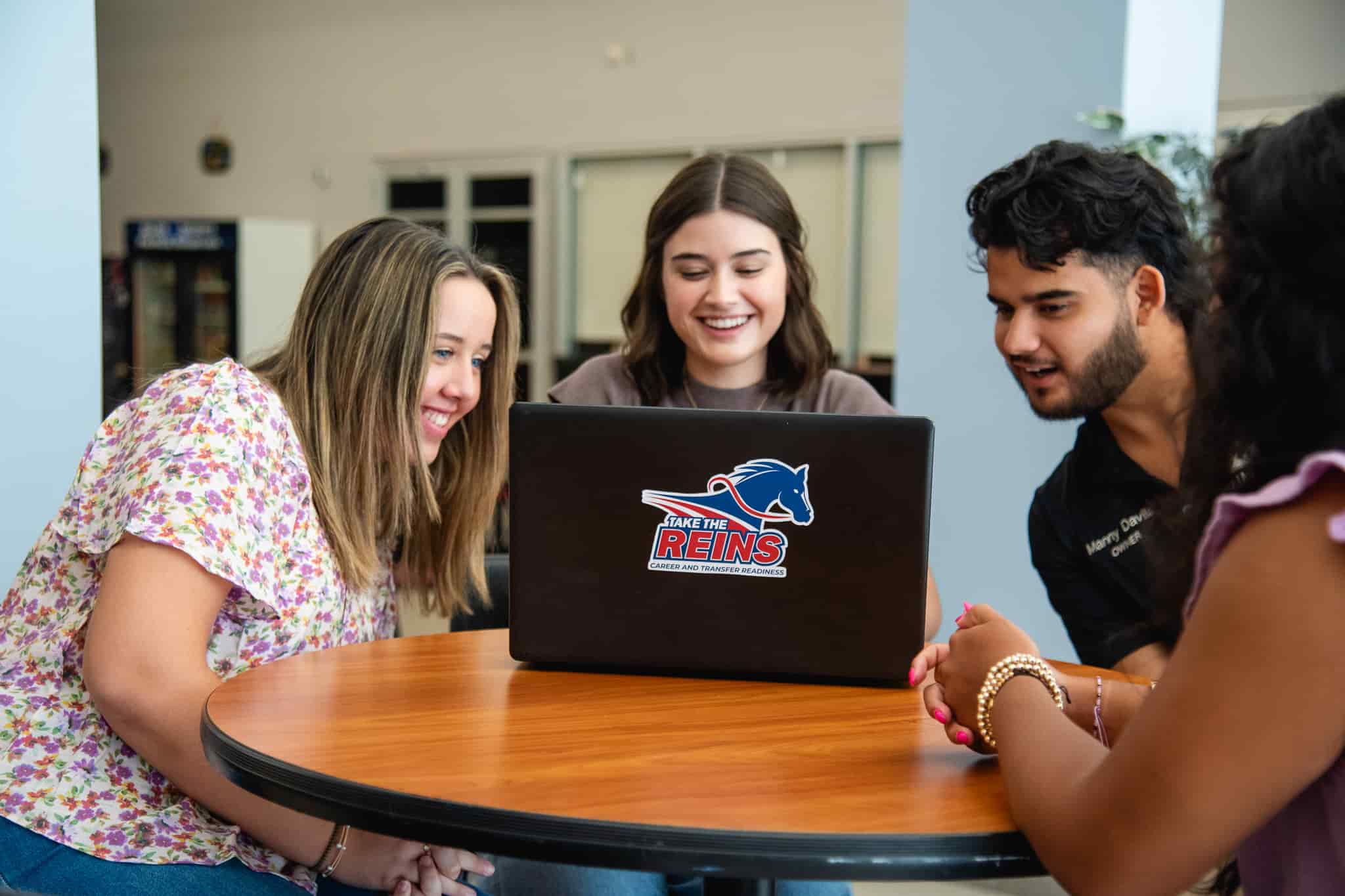 Students Around Laptop